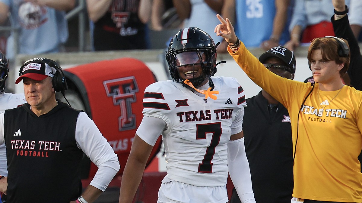 Texas Tech defensive back Brenden Jordan, No. 7, smiles and raises a finger after recovering a fumble.