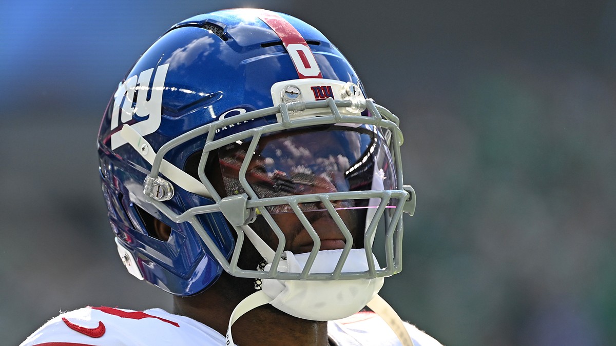 New York Giants linebacker Brian Burns looks toward the field in his helmet during a game against Philadelphia.