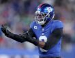 New York Giants linebacker Brian Burns gestures in celebration after recording a sack against Philadelphia.