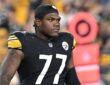 Pittsburgh Steelers offensive tackle Broderick Jones looks downfield in a skullcap during a game against the Jets.