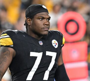 Pittsburgh Steelers offensive tackle Broderick Jones looks downfield in a skullcap during a game against the Jets.