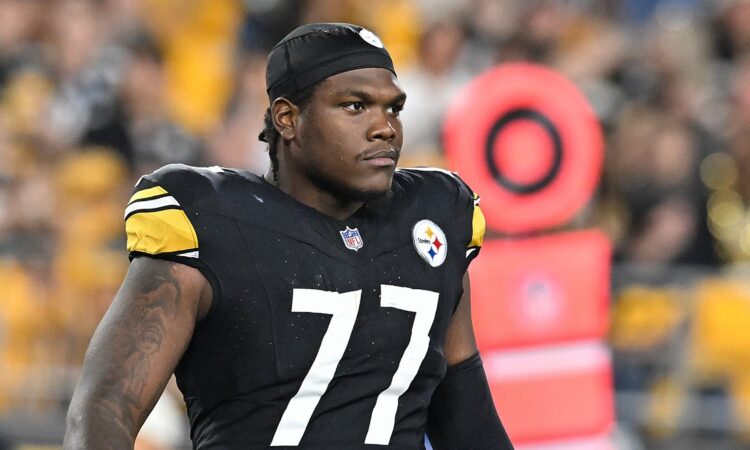 Pittsburgh Steelers offensive tackle Broderick Jones looks downfield in a skullcap during a game against the Jets.