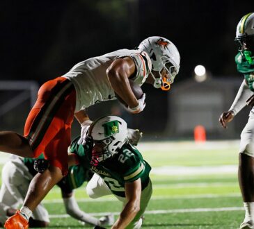 Mandarin wide receiver Brysen Wright is upended near the sideline as Nease defender Austin Taylor wraps him up.
