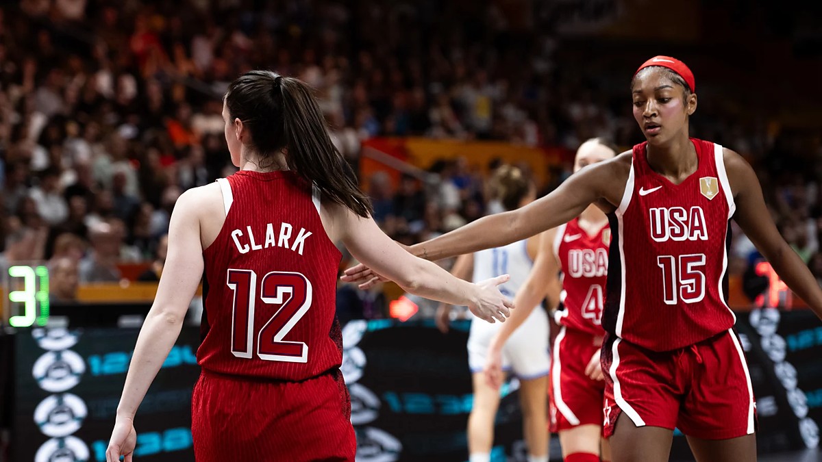 United States guard Caitlin Clark slaps hands with teammate Angel Reese during a game at the FIBA Women's World Cup.