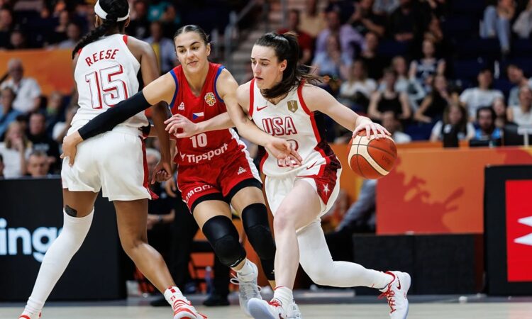 United States guard Caitlin Clark drives past a Czechia defender as teammate Angel Reese sets a screen.