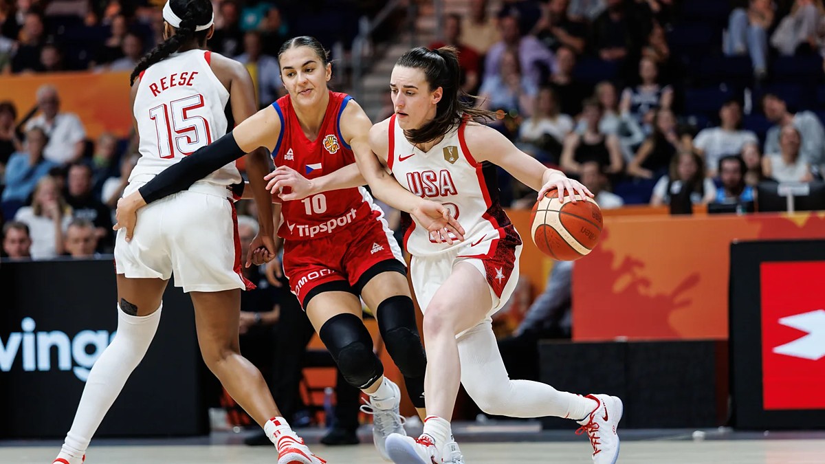 United States guard Caitlin Clark drives past a Czechia defender as teammate Angel Reese sets a screen.
