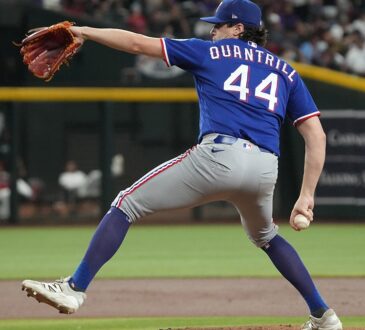 Texas Rangers pitcher Cal Quantrill strides toward the plate mid-delivery against Arizona at Chase Field.