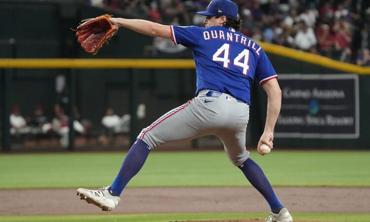 Texas Rangers pitcher Cal Quantrill strides toward the plate mid-delivery against Arizona at Chase Field.