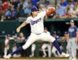 Texas Rangers right-hander Cal Quantrill, No. 44, strides toward the plate mid-delivery at Globe Life Field.