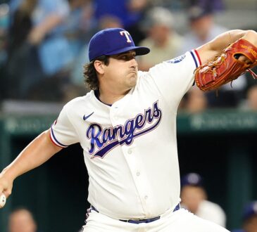 Texas Rangers pitcher Cal Quantrill rears back to throw in his white home uniform at Globe Life Field.