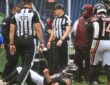 Chicago Bears quarterback Caleb Williams #18 lies on the field with an apparent injury against the Minnesota Vikings at Soldier Field.