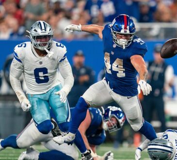 New York Giants running back Cam Skattebo loses the football as Dallas Cowboys defenders converge.