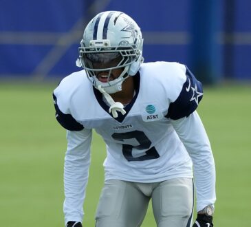 Dallas Cowboys cornerback Cobie Durant crouches in a backpedal stance during a joint practice with the Rams.