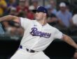 Texas Rangers pitcher Cody Bradford strides toward the plate in his white home uniform at Globe Life Field.