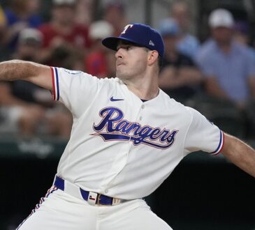 Texas Rangers pitcher Cody Bradford strides toward the plate in his white home uniform at Globe Life Field.