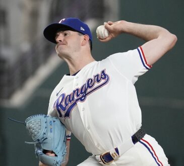 Texas Rangers pitcher Cody Bradford delivers in his white home uniform at Globe Life Field.