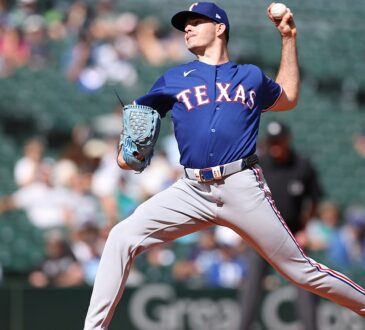 Texas Rangers starting pitcher Cody Bradford raises the ball in his delivery during a game against the Mariners.