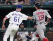 Texas Rangers pitcher Cody Bradford reaches out with his glove to tag Boston Red Sox runner Roman Anthony on the baseline.