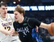 Dallas Mavericks forward Cooper Flagg dribbles with his right hand as Los Angeles Lakers forward Jake LaRavia defends.
