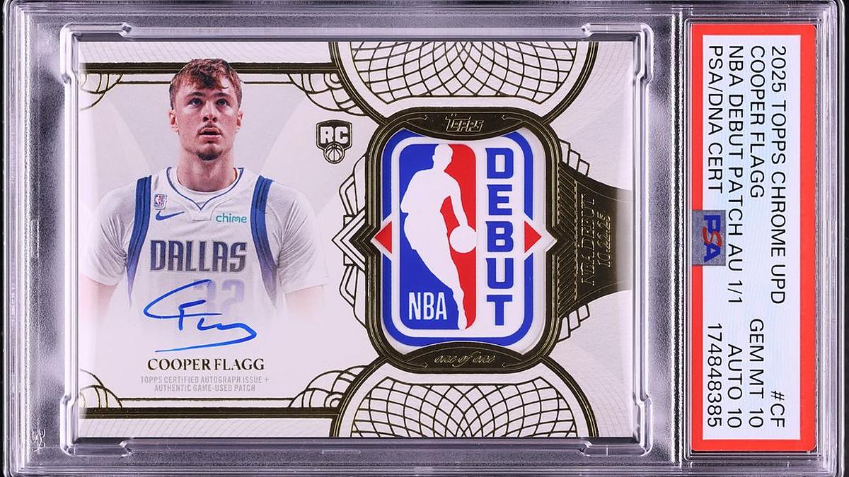 A graded Cooper Flagg rookie card with his autograph and an NBA Debut logo patch in a PSA slab.