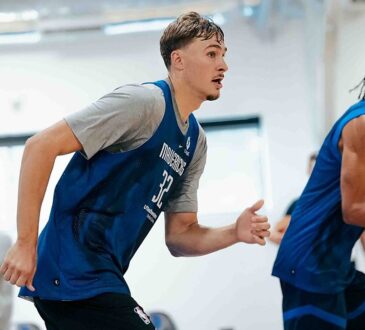 Dallas Mavericks forwards Cooper Flagg and Zaccharie Risacher run up the court side by side in blue practice jerseys.