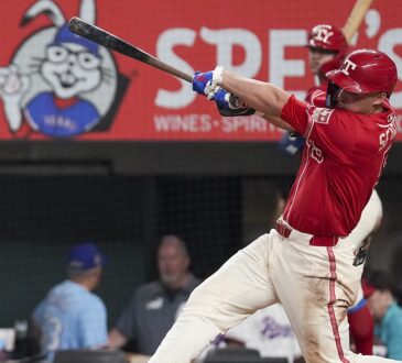 Texas Rangers shortstop Corey Seager follows through on a swing during a game against Toronto at Globe Life Field.