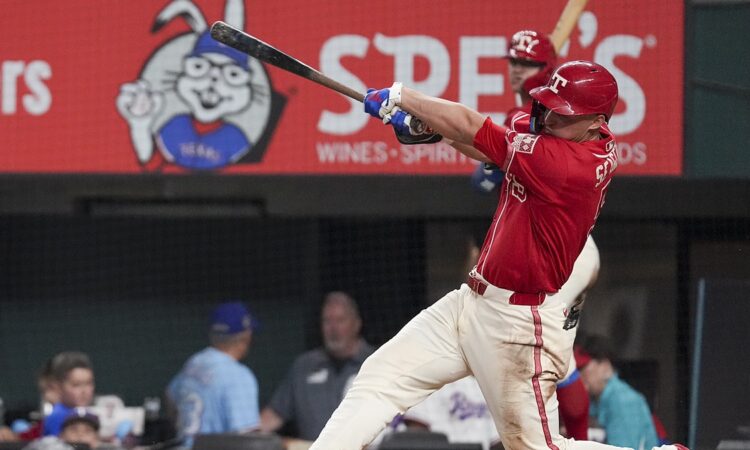 Texas Rangers shortstop Corey Seager follows through on a swing during a game against Toronto at Globe Life Field.