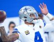Dallas Cowboys quarterback Dak Prescott throws during warmups before a game at MetLife Stadium.