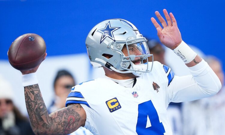 Dallas Cowboys quarterback Dak Prescott throws during warmups before a game at MetLife Stadium.