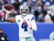 Dallas Cowboys quarterback Dak Prescott cocks his arm to throw as he looks downfield against the Giants.