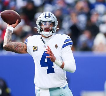 Dallas Cowboys quarterback Dak Prescott cocks his arm to throw as he looks downfield against the Giants.