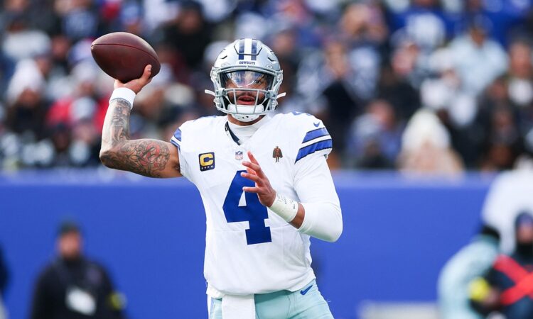 Dallas Cowboys quarterback Dak Prescott cocks his arm to throw as he looks downfield against the Giants.