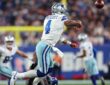 Dallas Cowboys quarterback Dak Prescott releases a pass as a New York Giants defender tackles him low.