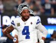 Dallas Cowboys quarterback Dak Prescott stands with his hands on his hips during warmups before facing the Giants.