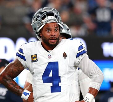 Dallas Cowboys quarterback Dak Prescott stands with his hands on his hips during warmups before facing the Giants.