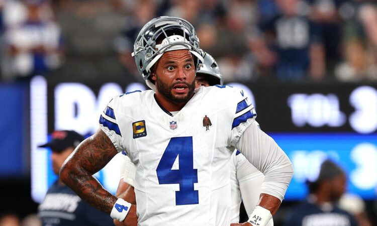 Dallas Cowboys quarterback Dak Prescott stands with his hands on his hips during warmups before facing the Giants.