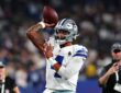 Cowboys quarterback Dak Prescott cocks his arm to throw during warmups before kickoff.