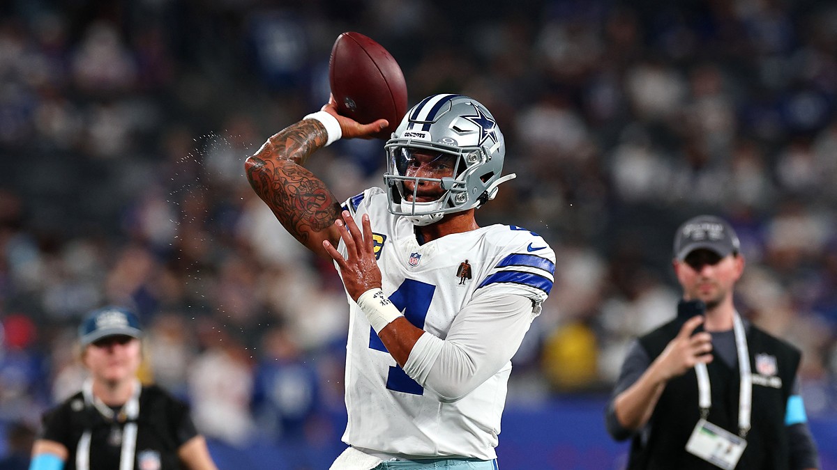 Cowboys quarterback Dak Prescott cocks his arm to throw during warmups before kickoff.