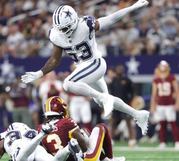 Dallas Cowboys linebacker Dee Winters hurdles a tackle as a teammate brings down a Commanders receiver.