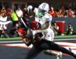 Abilene Christian defensive back Dillon Williams, No. 3, reaches in on Texas Tech tight end Terrance Carter Jr. as the ball comes loose.