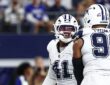 Dallas Cowboys defensive end Donovan Ezeiruaku smiles as he celebrates face to face with teammate Solomon Thomas.