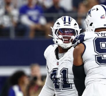 Dallas Cowboys defensive end Donovan Ezeiruaku smiles as he celebrates face to face with teammate Solomon Thomas.