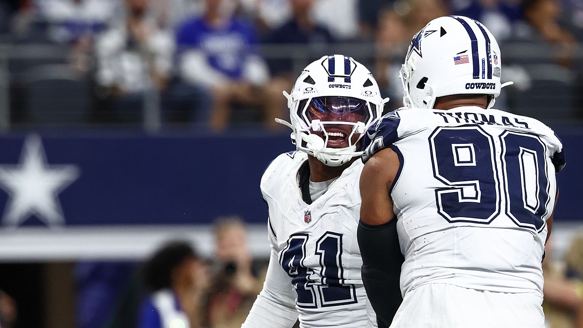 Dallas Cowboys defensive end Donovan Ezeiruaku smiles as he celebrates face to face with teammate Solomon Thomas.
