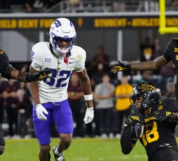 TCU wide receiver Dozie Ezukanma looks back as Arizona State defenders converge after an interception.