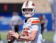 Oklahoma State quarterback Drew Mestemaker, No. 17, holds the ball at chest level during pregame warmups.