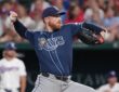 Tampa Bay Rays starting pitcher Drew Rasmussen, No. 57, comes set to deliver a pitch.
