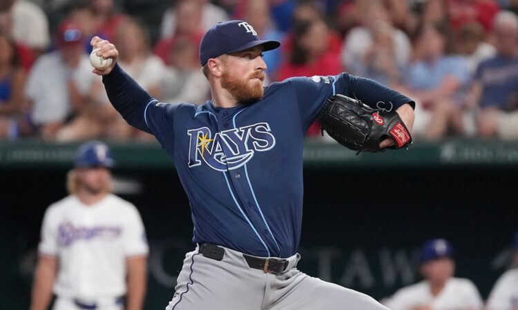 Tampa Bay Rays starting pitcher Drew Rasmussen, No. 57, comes set to deliver a pitch.