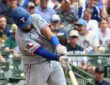 Texas Rangers catcher Elias Díaz drives a pitch with the ball visible off the barrel.