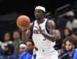 Dallas Mavericks forward Emanuel Miller catches a pass in front of the Dallas bench.