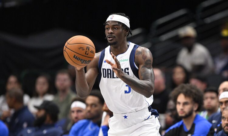 Dallas Mavericks forward Emanuel Miller catches a pass in front of the Dallas bench.